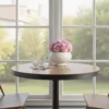 Cozy dining nook with wooden table, pink roses, and garden view