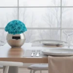 Modern dining table with turquoise floral centerpiece and winter view