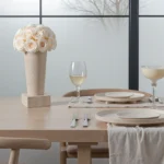 Modern dining room with white floral centerpiece and frosted windows