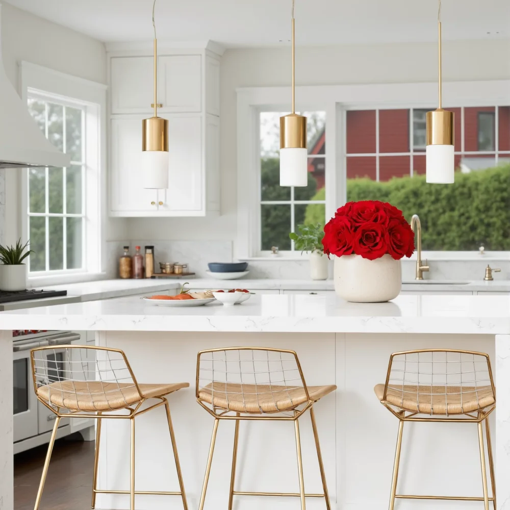 Modern kitchen with gold accents, woven chairs, and red rose bouquet