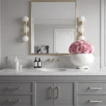 Elegant bathroom sink area with grey vanity and pink rose bouquet