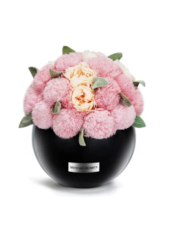 Black ceramic vase containing lush bouquet of pale pink and cream-colored roses labeled "MINDFUL MOMENT"