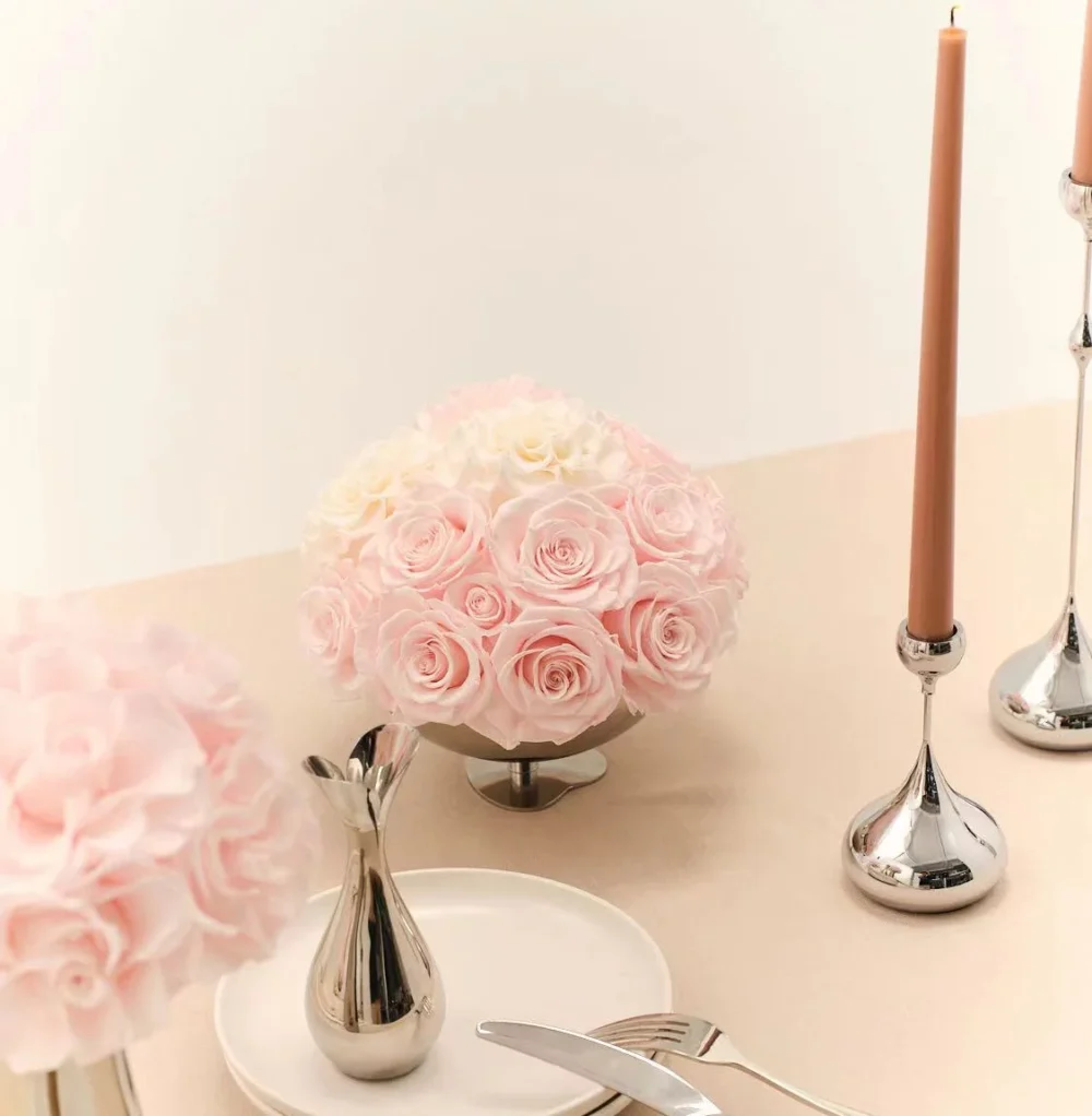 Elegant table with silver vase of pink and white roses