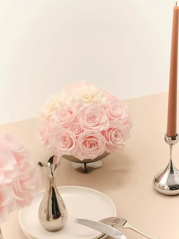 Elegant table with silver vase of pink and white roses