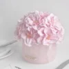Delicate pink hydrangea arrangement in pink vase labeled "Maison Honey"