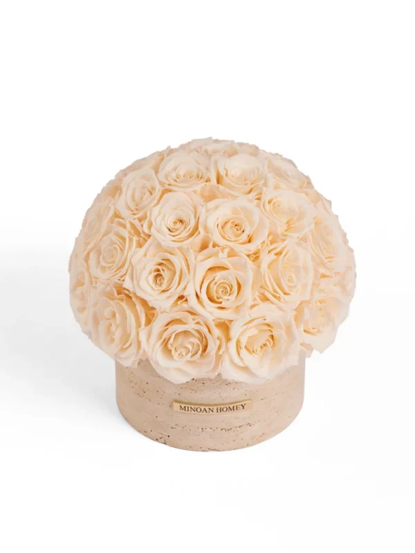 Spherical cream artificial rose arrangement with soft petals in textured cylinder vase labeled Michan Rosely on clean white background