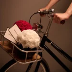 Black vintage bike with white rose bouquet and "Happily Ever After" card