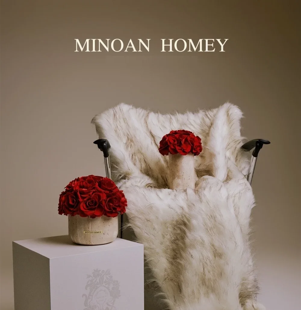 Luxurious modern interior with white faux fur chair and vase of red roses