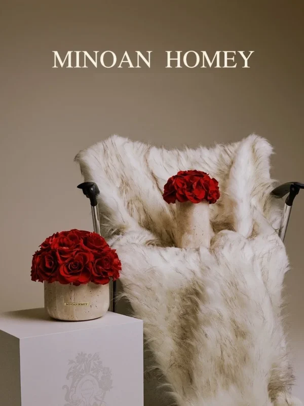 Luxurious modern interior with white faux fur chair and vase of red roses