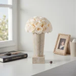 Vase with white roses on marble base
