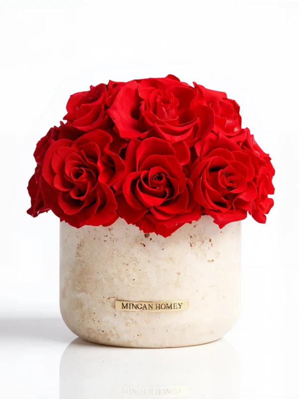 Beige Minoan Homey vase with vibrant red roses, minimalist flower arrangement against white