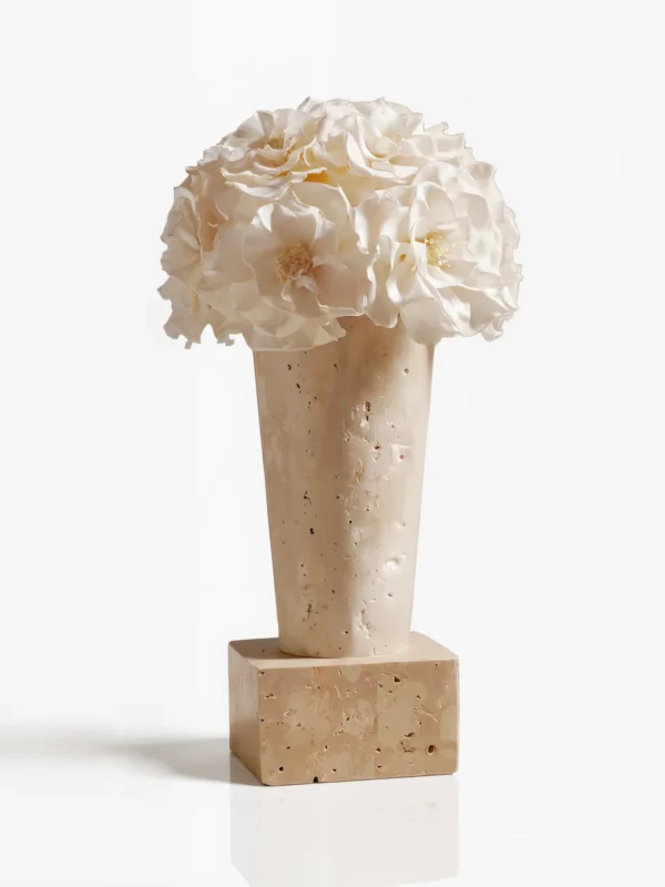 Tall light beige vase with white peony-like flowers, elegant floral design