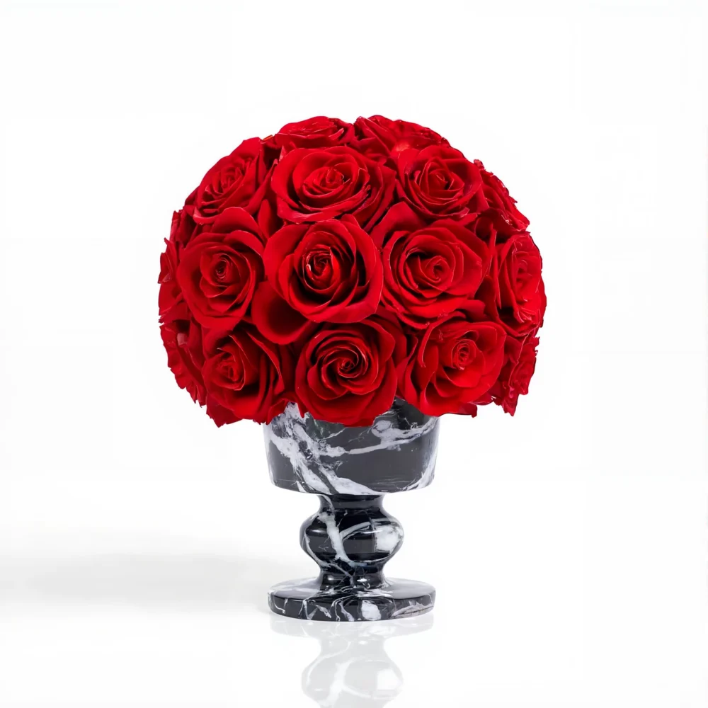 Glossy black marble vase with deep red roses, luxurious floral bouquet