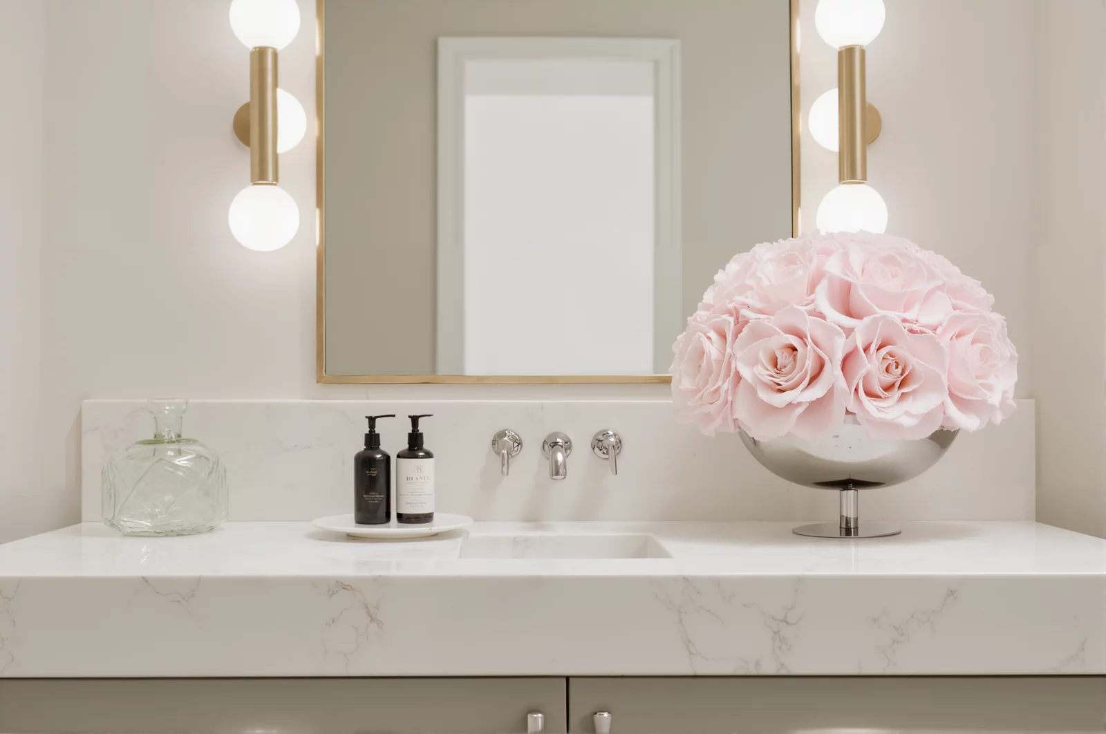 Silver vase with pink paper roses in a bathroom, modern floral centerpiece.