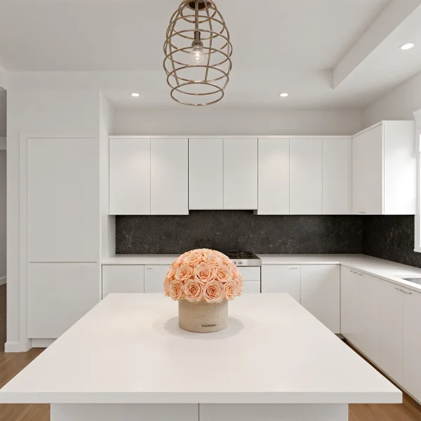 Sleek kitchen with black marble countertops and peach-colored roses
