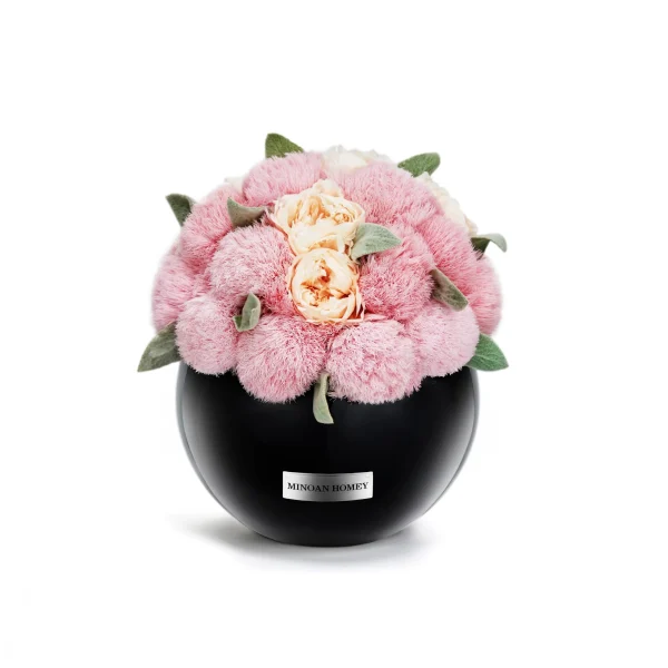 Black ceramic vase containing lush bouquet of pale pink and cream-colored roses labeled "MINDFUL MOMENT"