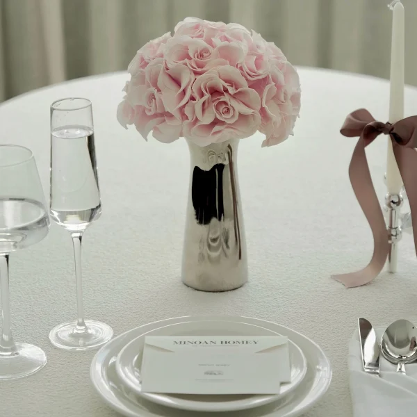 Minimalist elegant dining with pink roses and candles