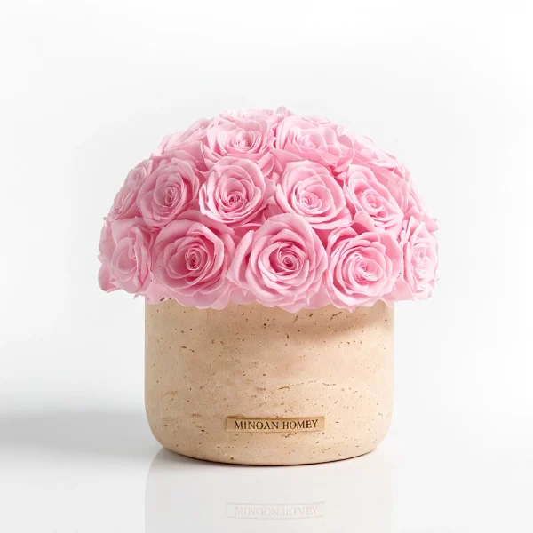 Textured beige Minoan Homey vase with dome-shaped pink roses, elegant floral arrangement