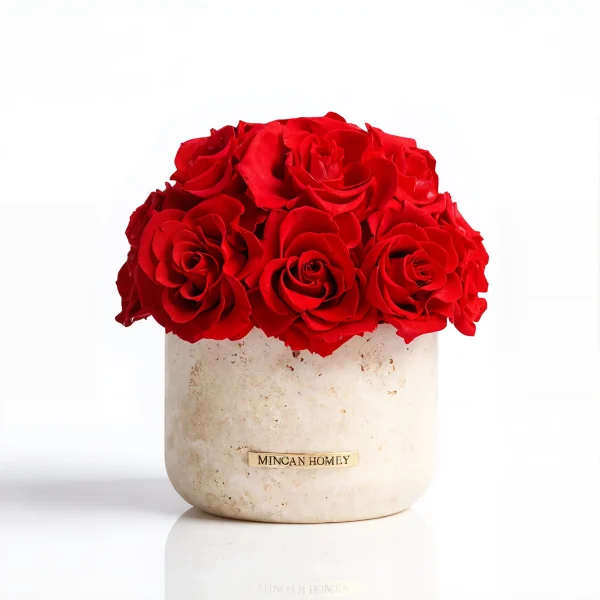 Beige Minoan Homey vase with vibrant red roses, minimalist flower arrangement against white