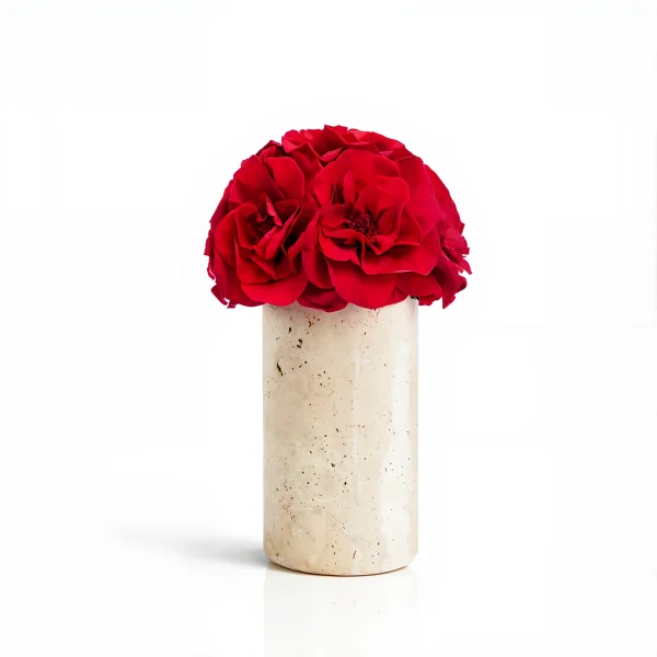Tall beige marble vase with deep red carnations, elegant floral composition