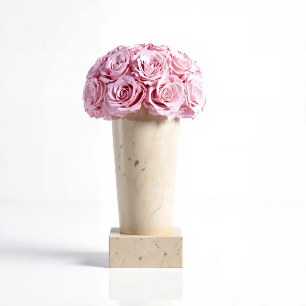 Pale beige marble vase with delicate pink roses, minimalist floral arrangement