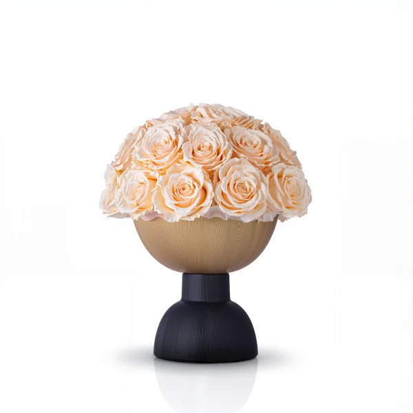 Matte gold spherical vase with peach roses, sophisticated floral design