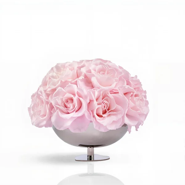 Metallic silver vase with pale pink roses, elegant floral composition